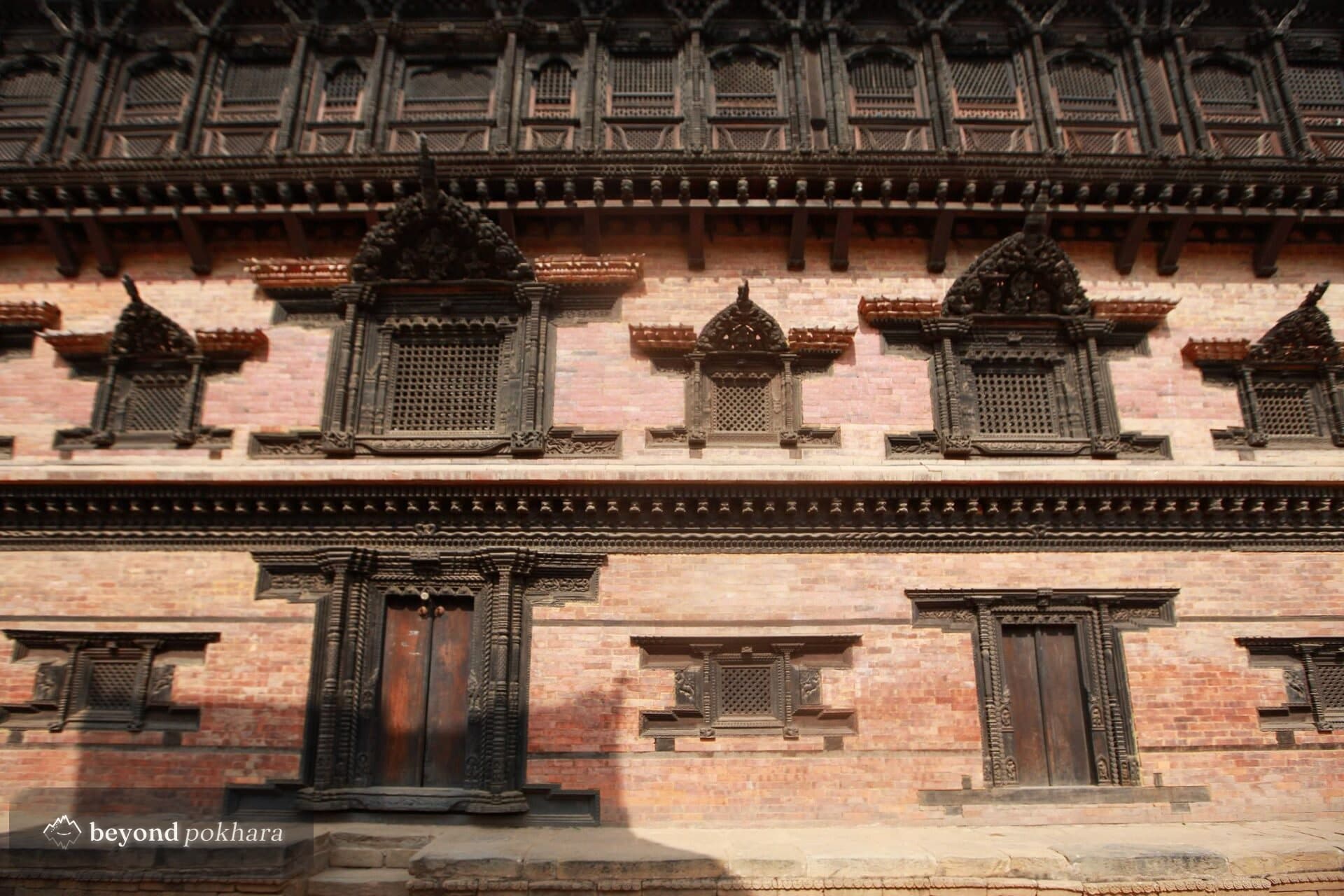 Carved Newari brick and timber facade in Tansen